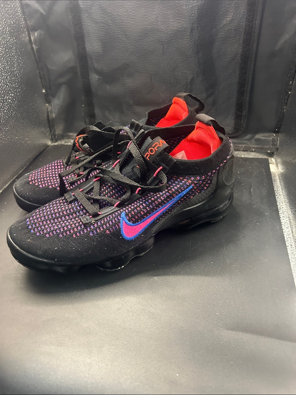 Nike women’s Black Shoes with Blue Swoosh and Pink Accents